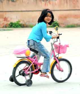 little girl on her training bike