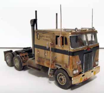 one groovy looking cab-over-engine toy truck